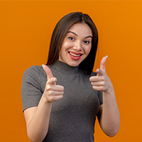 joyful-young-pretty-woman-doing-you-gesture-camera-isolated-orange-background-with-copy-space